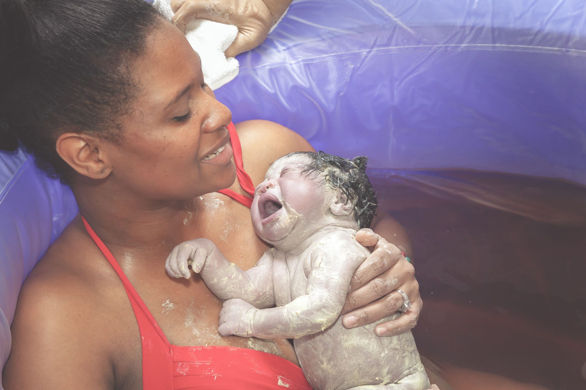 Black mother and baby waterbirth